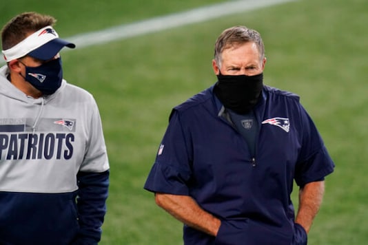 New England Patriots offensive coordinator Josh McDaniels and head coach Bill Belichick leave the field after an NFL football game against the San Francisco 49ers, Sunday, Oct. 25, 2020, in Foxborough, Mass. (AP Photo/Charles Krupa)