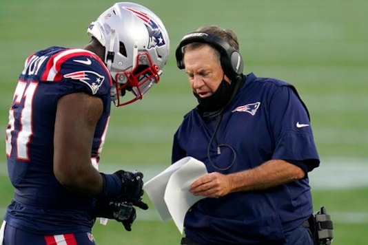 New England Patriots head coach Bill Belichick, right, gives instructions to linebacker Ja'Whaun Bentley (51) in the first half of an NFL football game against the San Francisco 49ers, Sunday, Oct. 25, 2020, in Foxborough, Mass. (AP Photo/Charles Krupa) New England Patriots head coach Bill Belichick, right, gives instructions to linebacker Ja'Whaun Bentley (51) in the first half of an NFL football game against the San Francisco 49ers, Sunday, Oct. 25, 2020, in Foxborough, Mass. (AP Photo/Charles Krupa)