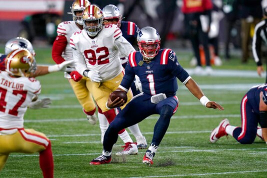 New England Patriots quarterback Cam Newton (1) scrambles away from San Francisco 49ers defenders Jamar Taylor, left, and Kerry Hyder Jr. (92) in the second half of an NFL football game, Sunday, Oct. 25, 2020, in Foxborough, Mass. (AP Photo/Charles Krupa) New England Patriots quarterback Cam Newton (1) scrambles away from San Francisco 49ers defenders Jamar Taylor, left, and Kerry Hyder Jr. (92) in the second half of an NFL football game, Sunday, Oct. 25, 2020, in Foxborough, Mass. (AP Photo/Charles Krupa)