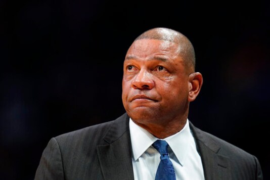 FILE - In this Jan. 12, 2020, file photo, Los Angeles Clippers coach Doc Rivers looks on during the second quarter of the team's NBA basketball game against the Denver Nuggets in Denver. The Philadelphia 76ers introduced Rivers as their head coach on Monday, Oct. 5, 2020. Rivers takes over as the 25th head coach in 76ers history after a seven-season run as head coach of the Clippers. (AP Photo/Jack Dempsey, File)