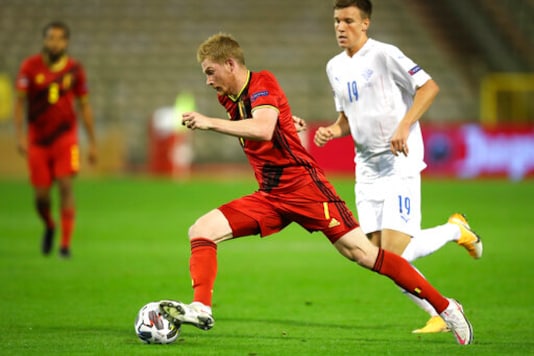 Belgium's Kevin De Bruyne, center, is pursued by Iceland's Andri Baldursson, right, during the UEFA Nations League soccer match between Belgium and Iceland, at the King Baudouin stadium in Brussels, Tuesday, Sept. 8, 2020. (AP Photo/Francisco Seco) Belgium's Kevin De Bruyne, center, is pursued by Iceland's Andri Baldursson, right, during the UEFA Nations League soccer match between Belgium and Iceland, at the King Baudouin stadium in Brussels, Tuesday, Sept. 8, 2020. (AP Photo/Francisco Seco)