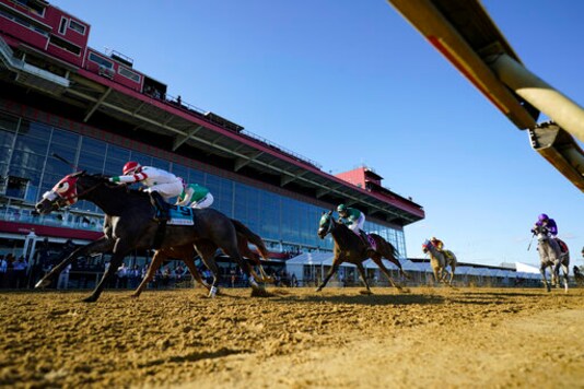 Miss Marissa (9), with Daniel Centeno aboard, wins the Black Eyed Susan horse race at Pimlico Race Course, Saturday, Oct. 3, 2020, in Baltimore. (AP Photo/Steve Helber)
