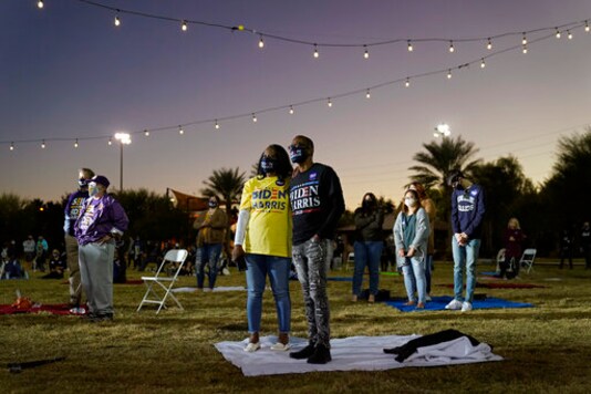 People listen as Democratic vice presidential candidate Sen. Kamala Harris, D-Calif., speaks at a campaign event Tuesday, Oct. 27, 2020, in Las Vegas. (AP Photo/John Locher)