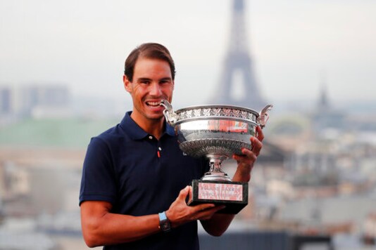 Spain's Rafael Nadal poses with his trophy during a photo call on the rooftop of Galeries Lafayette, Monday, Oct. 12, 2020, after winning the final match of the French Open tennis tournament against Serbia's Novak Djokovic in three sets, 6-0, 6-2, 7-5 at the Roland Garros stadium. (AP Photo/Francois Mori) Spain's Rafael Nadal poses with his trophy during a photo call on the rooftop of Galeries Lafayette, Monday, Oct. 12, 2020, after winning the final match of the French Open tennis tournament against Serbia's Novak Djokovic in three sets, 6-0, 6-2, 7-5 at the Roland Garros stadium. (AP Photo/Francois Mori)