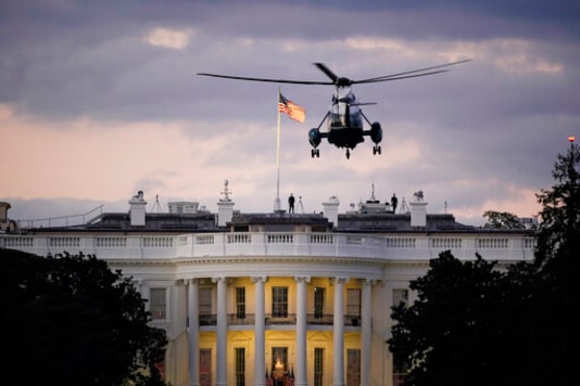 President Donald Trump arrives back at the White House aboard Marine One, Monday evening, Oct. 5, 2020 in Washington, after being treated for COVID-19 at Walter Reed National Military Medical Center. The president's personal physician, Dr. Sean Conley, told reporters on Monday afternoon that Trump is not out of the woods yet, but that there is no care at the hospital that the president cannot get at the White House. (AP Photo/J. Scott Applewhite) President Donald Trump arrives back at the White House aboard Marine One, Monday evening, Oct. 5, 2020 in Washington, after being treated for COVID-19 at Walter Reed National Military Medical Center. The president's personal physician, Dr. Sean Conley, told reporters on Monday afternoon that Trump is not out of the woods yet, but that there is no care at the hospital that the president cannot get at the White House. (AP Photo/J. Scott Applewhite)