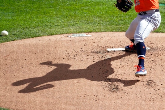 Houston Astros pitcher Jose Urquidy's shadow displays on the mound as he throws against the Minnesota Twins in the first inning of an American League wild-card series baseball game, Wednesday, Sept. 30, 2020, in Minneapolis. (AP Photo/Jim Mone) Houston Astros pitcher Jose Urquidy's shadow displays on the mound as he throws against the Minnesota Twins in the first inning of an American League wild-card series baseball game, Wednesday, Sept. 30, 2020, in Minneapolis. (AP Photo/Jim Mone)