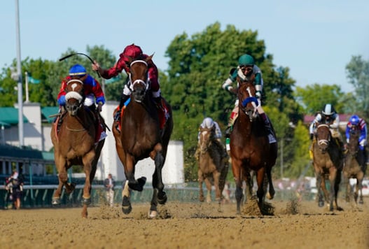 FILE - In this Sept. 4, 2020 file photo, Florent Geroux riding Shedaresthedevil crosses the finish line ahead of Tyler Gaffalione on Swiss Skydiver, left and John Velazquez riding Gamine to win the 146th running of the Kentucky Oaks at Churchill Downs in Louisville, Ky. Gamine, trained by two-time Triple Crown winner Bob Baffert, has tested positive in a post-race drug test for the second time this year, making it the third positive test by a horse in Bafferts stable in the last six months. Craig Robertson, Bafferts attorney, issued a statement confirming Gamines test results after her third-place finish as the 7-10 favorite in the Kentucky Oaks. (AP Photo/Jeff Roberson, File) FILE - In this Sept. 4, 2020 file photo, Florent Geroux riding Shedaresthedevil crosses the finish line ahead of Tyler Gaffalione on Swiss Skydiver, left and John Velazquez riding Gamine to win the 146th running of the Kentucky Oaks at Churchill Downs in Louisville, Ky. Gamine, trained by two-time Triple Crown winner Bob Baffert, has tested positive in a post-race drug test for the second time this year, making it the third positive test by a horse in Bafferts stable in the last six months. Craig Robertson, Bafferts attorney, issued a statement confirming Gamines test results after her third-place finish as the 7-10 favorite in the Kentucky Oaks. (AP Photo/Jeff Roberson, File)