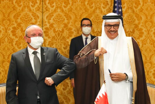 Israel's national security adviser, Meir Ben-Shabbat, left, bumps elbows with Bahrain's Foreign Minister Abdullatif al-Zayani after signing an agreement in Manama, Bahrain, Sunday, Oct. 18, 2020. Israel and Bahrain signed an agreement establishing formal diplomatic relations, making the Gulf country the fourth Arab state to normalize ties with Israel. (Ronen Zvulun/Pool Photo via AP) Israel's national security adviser, Meir Ben-Shabbat, left, bumps elbows with Bahrain's Foreign Minister Abdullatif al-Zayani after signing an agreement in Manama, Bahrain, Sunday, Oct. 18, 2020. Israel and Bahrain signed an agreement establishing formal diplomatic relations, making the Gulf country the fourth Arab state to normalize ties with Israel. (Ronen Zvulun/Pool Photo via AP)