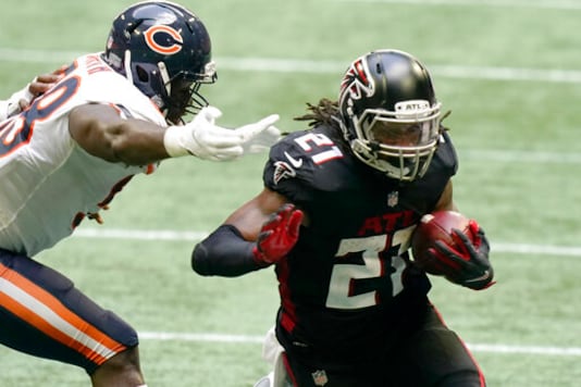 Atlanta Falcons running back Todd Gurley (21) runs against the Chicago Bears during the second half of an NFL football game, Sunday, Sept. 27, 2020, in Atlanta. (AP Photo/Brynn Anderson) Atlanta Falcons running back Todd Gurley (21) runs against the Chicago Bears during the second half of an NFL football game, Sunday, Sept. 27, 2020, in Atlanta. (AP Photo/Brynn Anderson)