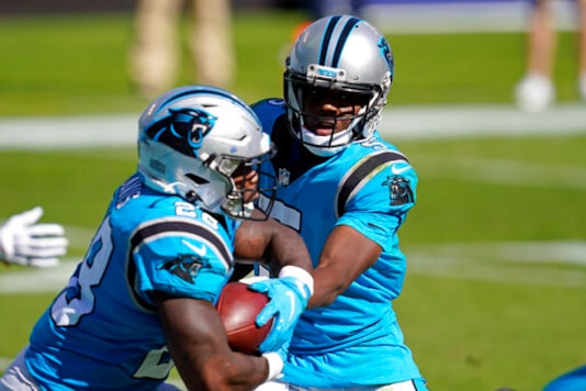Carolina Panthers quarterback Teddy Bridgewater hands off to running back Mike Davis (28) during the second half of an NFL football game in Charlotte, N.C., Sunday, Oct. 18, 2020. (AP Photo/Brian Blanco) Carolina Panthers quarterback Teddy Bridgewater hands off to running back Mike Davis (28) during the second half of an NFL football game in Charlotte, N.C., Sunday, Oct. 18, 2020. (AP Photo/Brian Blanco)
