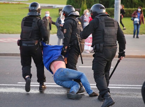 Riot police detain a protester during an opposition rally to protest the presidential inauguration in Minsk, Belarus, Wednesday, Sept. 23, 2020. Belarus President Alexander Lukashenko has been sworn in to his sixth term in office at an inaugural ceremony that was not announced in advance amid weeks of huge protests saying the authoritarian leader's reelection was rigged. Hundreds took to the streets in several cities in the evening to protest the inauguration. (AP Photo/TUT.by) Riot police detain a protester during an opposition rally to protest the presidential inauguration in Minsk, Belarus, Wednesday, Sept. 23, 2020. Belarus President Alexander Lukashenko has been sworn in to his sixth term in office at an inaugural ceremony that was not announced in advance amid weeks of huge protests saying the authoritarian leader's reelection was rigged. Hundreds took to the streets in several cities in the evening to protest the inauguration. (AP Photo/TUT.by)