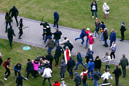 People clash with plainclothes policemen during an opposition rally to protest the official presidential election results in Minsk, Belarus, Sunday, Oct. 11, 2020. Hundreds of thousands of Belarusians have been protesting daily since the Aug. 9 presidential election. (AP Photo) People clash with plainclothes policemen during an opposition rally to protest the official presidential election results in Minsk, Belarus, Sunday, Oct. 11, 2020. Hundreds of thousands of Belarusians have been protesting daily since the Aug. 9 presidential election. (AP Photo)