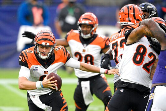 Cincinnati Bengals quarterback Joe Burrow scrambles against the Baltimore Ravens during the second half of an NFL football game, Sunday, Oct. 11, 2020, in Baltimore. (AP Photo/Nick Wass)