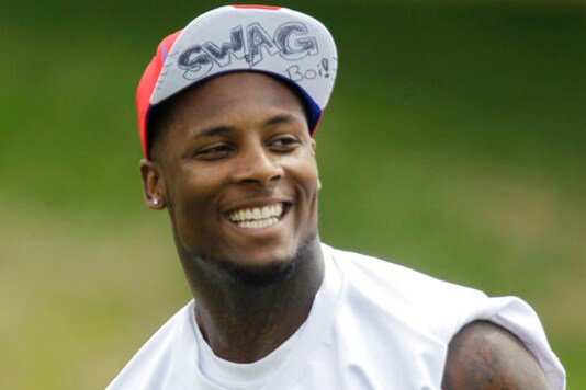 FILE - In this July 31, 2011, file photo, Buffalo Bills' Stevie Johnson smiles during an NFL football training camp in Pittsford, N.Y. The Mafia is becoming legitimate in Buffalo the Bills Mafia that is. The Bills last week filed an application to trademark its fanbases adopted nickname in preparation to launch a series of branded merchandise and apparel available at its team store and sold online. The nickname stemmed from former Bills receiver Stevie Johnson questioning God on Twitter for having a sure touchdown pass fall through his hands in overtime of a 19-16 loss to Pittsburgh on Nov. 28, 2010. (AP Photo/David Duprey, File) FILE - In this July 31, 2011, file photo, Buffalo Bills' Stevie Johnson smiles during an NFL football training camp in Pittsford, N.Y. The Mafia is becoming legitimate in Buffalo the Bills Mafia that is. The Bills last week filed an application to trademark its fanbases adopted nickname in preparation to launch a series of branded merchandise and apparel available at its team store and sold online. The nickname stemmed from former Bills receiver Stevie Johnson questioning God on Twitter for having a sure touchdown pass fall through his hands in overtime of a 19-16 loss to Pittsburgh on Nov. 28, 2010. (AP Photo/David Duprey, File)