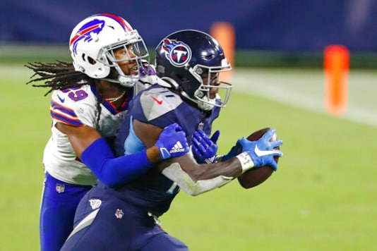 Tennessee Titans wide receiver A.J. Brown (11) is stopped by Buffalo Bills cornerback Josh Norman (29) in the second half of an NFL football game Tuesday, Oct. 13, 2020, in Nashville, Tenn. (AP Photo/Wade Payne) Tennessee Titans wide receiver A.J. Brown (11) is stopped by Buffalo Bills cornerback Josh Norman (29) in the second half of an NFL football game Tuesday, Oct. 13, 2020, in Nashville, Tenn. (AP Photo/Wade Payne)