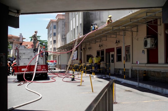 Firefighters work to douse a fire that broke out at the Bonsucesso Federal Hospital, which has a COVID-19 wing, in Rio de Janeiro, Brazil, Tuesday, Oct. 27, 2020. According to the fire department, there were no casualties. (AP Photo/Silvia Izquierdo) Firefighters work to douse a fire that broke out at the Bonsucesso Federal Hospital, which has a COVID-19 wing, in Rio de Janeiro, Brazil, Tuesday, Oct. 27, 2020. According to the fire department, there were no casualties. (AP Photo/Silvia Izquierdo)