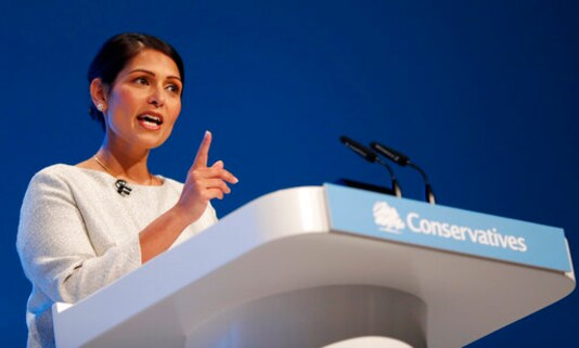 FILE - In this Tuesday, Oct. 1, 2019 file photo, Britain's Home Secretary Priti Patel addresses the delegates at the Conservative Party Conference in Manchester, England. Britains interior minister vowed Sunday, Oct. 4, 2020 to stop people entering the country clandestinely and to fix what she called a broken asylum system, echoing commitments that have been made and broken by U.K. governments for years. Home Secretary Priti Patel said the government would bring in new laws so it could stop those who come here illegally making endless legal claims to remain and expedite the removal of those who have no claim for protection. (AP Photo/Frank Augstein, file) FILE - In this Tuesday, Oct. 1, 2019 file photo, Britain's Home Secretary Priti Patel addresses the delegates at the Conservative Party Conference in Manchester, England. Britains interior minister vowed Sunday, Oct. 4, 2020 to stop people entering the country clandestinely and to fix what she called a broken asylum system, echoing commitments that have been made and broken by U.K. governments for years. Home Secretary Priti Patel said the government would bring in new laws so it could stop those who come here illegally making endless legal claims to remain and expedite the removal of those who have no claim for protection. (AP Photo/Frank Augstein, file)