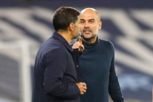 Manchester City's head coach Pep Guardiola, right, argues with Porto's head coach Sergio Conceicao, left, during the Champions League group C soccer match between Manchester City and FC Porto at the Etihad stadium in Manchester, England, Wednesday, Oct. 21, 2020. (Martin Rickett/Pool via AP) Manchester City's head coach Pep Guardiola, right, argues with Porto's head coach Sergio Conceicao, left, during the Champions League group C soccer match between Manchester City and FC Porto at the Etihad stadium in Manchester, England, Wednesday, Oct. 21, 2020. (Martin Rickett/Pool via AP)