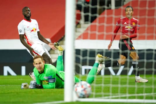 Manchester United's Mason Greenwood, right, scores his side's opening goal during the Champions League group H soccer match between Manchester United and RB Leipzig, at the Old Trafford stadium in Manchester, England, Wednesday, Oct. 28, 2020. (AP Photo/Dave Thompson) Manchester United's Mason Greenwood, right, scores his side's opening goal during the Champions League group H soccer match between Manchester United and RB Leipzig, at the Old Trafford stadium in Manchester, England, Wednesday, Oct. 28, 2020. (AP Photo/Dave Thompson)
