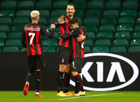 AC Milan's Brahim Diaz, right, celebrates with teammates Zlatan Ibrahimovic, center and Samu Castillejo, left, after scoring his team's second goal during the Europa League Group H first leg soccer match between Celtic and AC Milan at the Celtic Park stadium in Glasgow, Scotland, Thursday, Oct. 22, 2020. (Jane Barlow/Pool via AP)