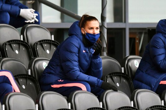 Tottenham Hotspur's Alex Morgan sit in the stands during the FA Women's Super League soccer match between Tottenham Hotspur and Manchester United, at the Hive, in London, Saturday, Oct. 10, 2020. (Kirsty O'Connor/PA via AP)