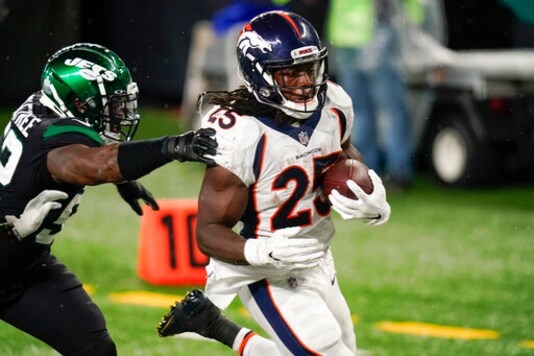 Denver Broncos running back Melvin Gordon (25) runs past New York Jets outside linebacker Alec Ogletree (52) for a touchdown during the second half of an NFL football game Thursday, Oct. 1, 2020, in East Rutherford, N.J. (AP Photo/Seth Wenig) Denver Broncos running back Melvin Gordon (25) runs past New York Jets outside linebacker Alec Ogletree (52) for a touchdown during the second half of an NFL football game Thursday, Oct. 1, 2020, in East Rutherford, N.J. (AP Photo/Seth Wenig)