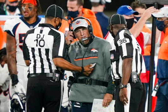 Denver Broncos head coach Vic Fangio talks to officials during the first half of an NFL football game against the New York Jets Thursday, Oct. 1, 2020, in East Rutherford, N.J.Maybe the third time will actually bring a kickoff between for the Denver Broncos and New England Patriots. After having their original Week 5 matchup twice postponed because of a mini outbreak of coronavirus cases on the Patriots that saw four players including quarterback Cam Newton and reigning Defensive Player of the Year Stephon Gilmore test positive, the teams are hopeful they will finally meet this week. (AP Photo/John Minchillo) Denver Broncos head coach Vic Fangio talks to officials during the first half of an NFL football game against the New York Jets Thursday, Oct. 1, 2020, in East Rutherford, N.J.Maybe the third time will actually bring a kickoff between for the Denver Broncos and New England Patriots. After having their original Week 5 matchup twice postponed because of a mini outbreak of coronavirus cases on the Patriots that saw four players including quarterback Cam Newton and reigning Defensive Player of the Year Stephon Gilmore test positive, the teams are hopeful they will finally meet this week. (AP Photo/John Minchillo)