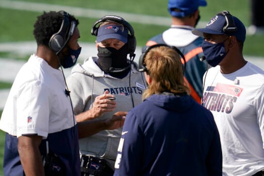 New England Patriots head coach Bill Belichick, center, consults with defensive coaches in the first half of an NFL football game against the Denver Broncos, Sunday, Oct. 18, 2020, in Foxborough, Mass. (AP Photo/Charles Krupa) New England Patriots head coach Bill Belichick, center, consults with defensive coaches in the first half of an NFL football game against the Denver Broncos, Sunday, Oct. 18, 2020, in Foxborough, Mass. (AP Photo/Charles Krupa)