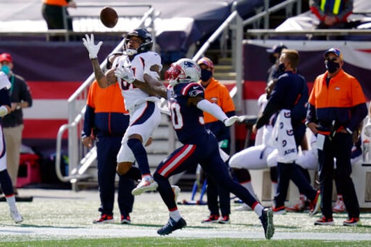 Denver Broncos wide receiver Tim Patrick (81) catches a pass as New England Patriots cornerback Jason McCourty (30) defends in the first half of an NFL football game, Sunday, Oct. 18, 2020, in Foxborough, Mass. (AP Photo/Charles Krupa) Denver Broncos wide receiver Tim Patrick (81) catches a pass as New England Patriots cornerback Jason McCourty (30) defends in the first half of an NFL football game, Sunday, Oct. 18, 2020, in Foxborough, Mass. (AP Photo/Charles Krupa)
