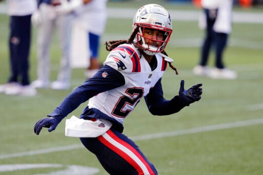New England Patriots cornerback Stephon Gilmore warms up before an NFL football game against the Seattle Seahawks, Sunday, Sept. 20, 2020, in Seattle. For the second straight week the New England Patriots are heading into a game after having their preparations disrupted by a teammate contracting coronavirus. Last week it was Cam Newton. This week the Patriots' facility was closed for most of the week after reigning Defensive Player of the Year Stephon Gilmore joined Newton on the reserve/COVID-19 list. (AP Photo/John Froschauer, File)