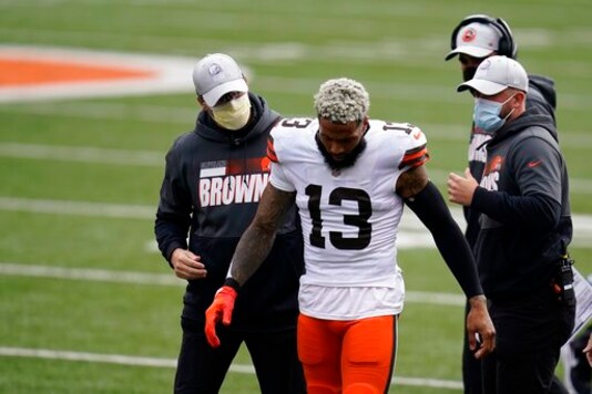 Cleveland Browns' Odell Beckham Jr. (13) leaves the field after being injured during the first half of an NFL football game against the Cincinnati Bengals, Sunday, Oct. 25, 2020, in Cincinnati. Browns star wide receiver Odell Beckham Jr. will miss the rest of the season after tearing a knee ligament during Sunday's 37-34 win at Cincinnati. (AP Photo/Michael Conroy) Cleveland Browns' Odell Beckham Jr. (13) leaves the field after being injured during the first half of an NFL football game against the Cincinnati Bengals, Sunday, Oct. 25, 2020, in Cincinnati. Browns star wide receiver Odell Beckham Jr. will miss the rest of the season after tearing a knee ligament during Sunday's 37-34 win at Cincinnati. (AP Photo/Michael Conroy)