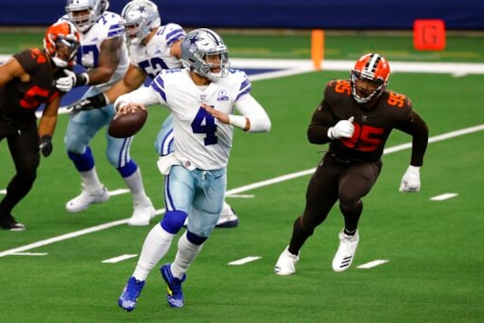 Dallas Cowboys quarterback Dak Prescott (4) scrambles out of the pocket before throwing a pass under pressure from Cleveland Browns defensive end Myles Garrett (95) in the first half of an NFL football game in Arlington, Texas, Sunday, Oct. 4, 2020. (AP Photo/Ron Jenkins) Dallas Cowboys quarterback Dak Prescott (4) scrambles out of the pocket before throwing a pass under pressure from Cleveland Browns defensive end Myles Garrett (95) in the first half of an NFL football game in Arlington, Texas, Sunday, Oct. 4, 2020. (AP Photo/Ron Jenkins)