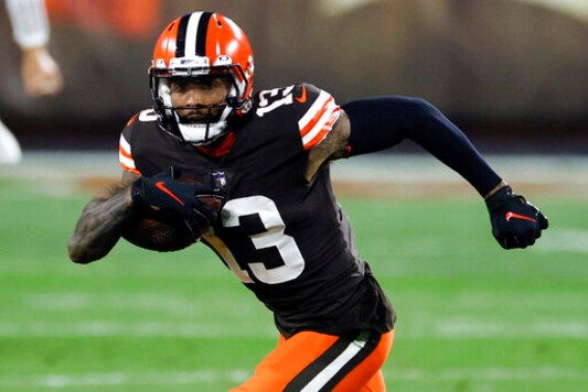 FILE - In this Thursday, Sept. 17, 2020, file photo, Cleveland Browns wide receiver Odell Beckham Jr. (13) plays against the Cincinnati Bengals during the first half of an NFL football game in Cleveland. Beckham Jr. practiced after missing time with a back injury earlier this week and is expected to play Sunday against the Dallas Cowboys.  (AP Photo/Ron Schwane, File)
