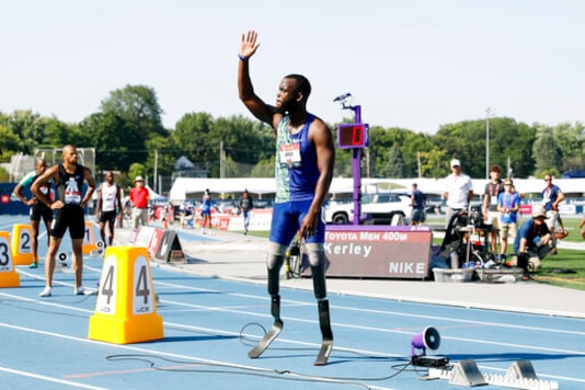 FILE - In this Saturday, July 27, 2019 file photo, Blake Leeper waves to the crowd before the men's 400-meter dash at the U.S. Championships athletics meet, in Des Moines, Iowa. Blake Leeper who uses two prosthetic legs lost an appeal Monday Oct. 26, 2020, in his bid to try to qualify for the Tokyo Olympics. The Court of Arbitration for Sport upheld a decision by the governing body of track that had ruled Blake Leepers prostheses give him a competitive advantage against able-bodied runners because of the added height. (AP Photo/Charlie Neibergall, File) FILE - In this Saturday, July 27, 2019 file photo, Blake Leeper waves to the crowd before the men's 400-meter dash at the U.S. Championships athletics meet, in Des Moines, Iowa. Blake Leeper who uses two prosthetic legs lost an appeal Monday Oct. 26, 2020, in his bid to try to qualify for the Tokyo Olympics. The Court of Arbitration for Sport upheld a decision by the governing body of track that had ruled Blake Leepers prostheses give him a competitive advantage against able-bodied runners because of the added height. (AP Photo/Charlie Neibergall, File)