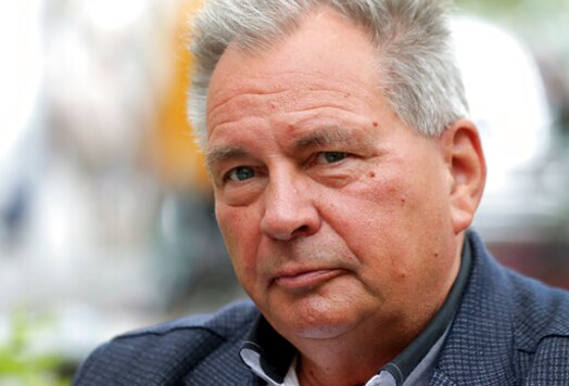 Corrects Slug - Frank Mader, former press attache of the embassy of the GDR (German Democratic Republic) in Washington, speaks during an interview with the Associated Press in Berlin, Germany, Thursday, Sept. 24, 2020. Germany marks 30 years since its reunification between communist East Germany and capitalist West Germany, (AP Photo/Michael Sohn) Corrects Slug - Frank Mader, former press attache of the embassy of the GDR (German Democratic Republic) in Washington, speaks during an interview with the Associated Press in Berlin, Germany, Thursday, Sept. 24, 2020. Germany marks 30 years since its reunification between communist East Germany and capitalist West Germany, (AP Photo/Michael Sohn)