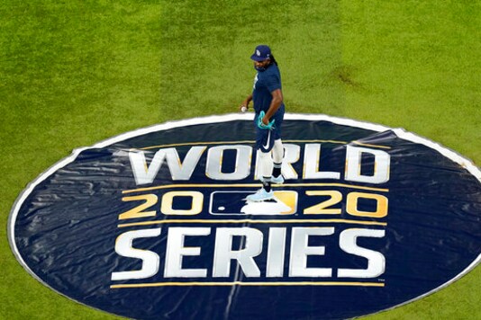 CORRECTS DATE TO MONDAY, OCT. 19, 2020 - Tampa Bay Rays relief pitcher Diego Castillo (63) stands on the pitcher's mound at Globe Life Field as the team prepares for the baseball World Series against the Los Angeles Dodgers, in Arlington, Texas, Monday, Oct. 19, 2020. (AP Photo/Eric Gay)