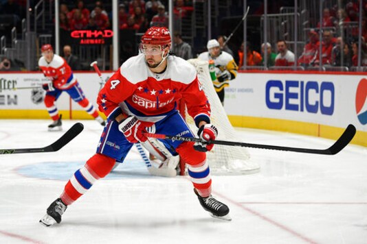 File-Washington Capitals defenseman Brenden Dillon (4) skates during the first period of an NHL hockey game against the Pittsburgh Penguins, Sunday, Feb. 23, 2020, in Washington. Washington re-signed Dillon to a $15.6 million, four-year contract Tuesday, Oct. 6, 2020, an announcement that came minutes after saying Michal Kempny would miss 6-8 months following surgery to repair a torn Achilles tendon. (AP Photo/Nick Wass, File)