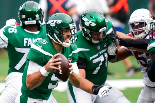 New York Jets quarterback Joe Flacco (5) looks to pass on the run during the first half of an NFL football game against the Arizona Cardinals, Sunday, Oct. 11, 2020, in East Rutherford. (AP Photo/Frank Franklin II) New York Jets quarterback Joe Flacco (5) looks to pass on the run during the first half of an NFL football game against the Arizona Cardinals, Sunday, Oct. 11, 2020, in East Rutherford. (AP Photo/Frank Franklin II)