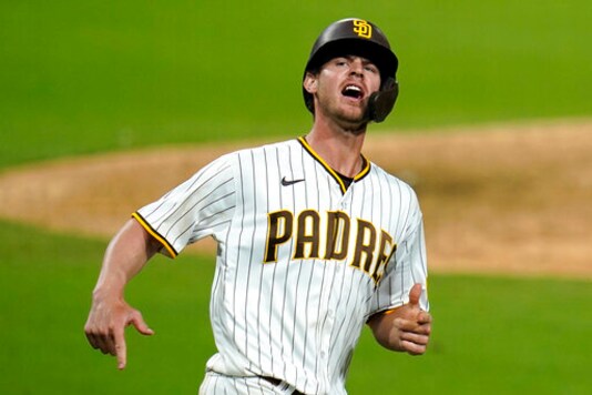 San Diego Padres' Wil Myers reacts after hitting a home run during the seventh inning of Game 2 of the team's National League wild-card baseball series against the St. Louis Cardinals, Thursday, Oct. 1, 2020, in San Diego. (AP Photo/Gregory Bull)