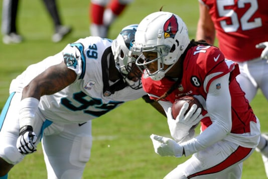 Arizona Cardinals wide receiver DeAndre Hopkins, right, runs past Carolina Panthers defensive tackle Kawann Short during the second half of an NFL football game Sunday, Oct. 4, 2020, in Charlotte, N.C. (AP Photo/Mike McCarn) Arizona Cardinals wide receiver DeAndre Hopkins, right, runs past Carolina Panthers defensive tackle Kawann Short during the second half of an NFL football game Sunday, Oct. 4, 2020, in Charlotte, N.C. (AP Photo/Mike McCarn)