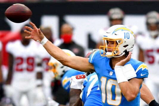 Los Angeles Chargers quarterback Justin Herbert (10) fires a pass against the Tampa Bay Buccaneers during the first half of an NFL football game Sunday, Oct. 4, 2020, in Tampa, Fla. (AP Photo/Jason Behnken)