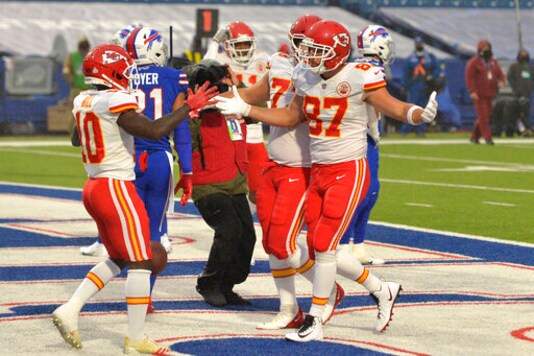 Kansas City Chiefs' Travis Kelce (87), right, celebrates a touchdown during the first half of an NFL football game against the Buffalo Bills, Monday, Oct. 19, 2020, in Orchard Park, N.Y. (AP Photo/Adrian Kraus)