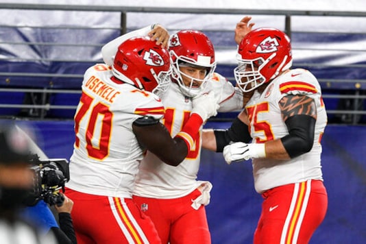 Kansas City Chiefs offensive guard Kelechi Osemele, left, quarterback Patrick Mahomes and offensive tackle Mike Remmers celebrate Mahomes touchdown during the first half of an NFL football game against the Baltimore Ravens, Monday, Sept. 28, 2020, in Baltimore. (AP Photo/Nick Wass) Kansas City Chiefs offensive guard Kelechi Osemele, left, quarterback Patrick Mahomes and offensive tackle Mike Remmers celebrate Mahomes touchdown during the first half of an NFL football game against the Baltimore Ravens, Monday, Sept. 28, 2020, in Baltimore. (AP Photo/Nick Wass)