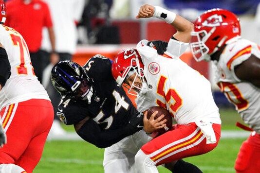 Baltimore Ravens linebacker Tyus Bowser (54) tries but cannot sack Kansas City Chiefs quarterback Patrick Mahomes (15) during the first half of an NFL football game Monday, Sept. 28, 2020, in Baltimore. (AP Photo/Nick Wass)
