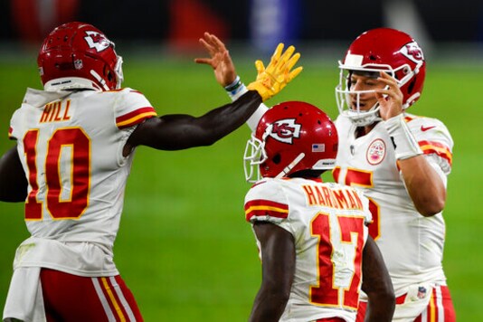 Kansas City Chiefs wide receiver Tyreek Hill (10) and quarterback Patrick Mahomes (15) celebrate after connecting for a touchdown with wide receiver Mecole Hardman (17) nearby during the first half of an NFL football game against the Baltimore Ravens, Monday, Sept. 28, 2020, in Baltimore. (AP Photo/Gail Burton) Kansas City Chiefs wide receiver Tyreek Hill (10) and quarterback Patrick Mahomes (15) celebrate after connecting for a touchdown with wide receiver Mecole Hardman (17) nearby during the first half of an NFL football game against the Baltimore Ravens, Monday, Sept. 28, 2020, in Baltimore. (AP Photo/Gail Burton)