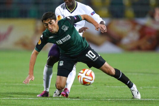 FILE - In this Oct. 2, 2014, file photo, Krasnodar's Odil Ahmedov, front, fights for the ball with Everton's Christian Atsu during the Europa League Group H soccer match between Krasnodar and Everton in Krasnodar, Russia. In a bid to complete the 2020 season in the midst of restrictions caused by the COVID-19 pandemic, the Chinese Football Association decided to split the 16 top-tier CSL teams into two groups based in the hub cities of Dalian and Suzhou. (AP Photo/Vitaly Timkiv, File) FILE - In this Oct. 2, 2014, file photo, Krasnodar's Odil Ahmedov, front, fights for the ball with Everton's Christian Atsu during the Europa League Group H soccer match between Krasnodar and Everton in Krasnodar, Russia. In a bid to complete the 2020 season in the midst of restrictions caused by the COVID-19 pandemic, the Chinese Football Association decided to split the 16 top-tier CSL teams into two groups based in the hub cities of Dalian and Suzhou. (AP Photo/Vitaly Timkiv, File)