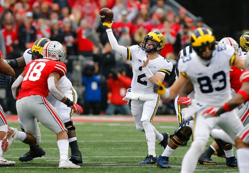 FILE - In this Nov. 24, 2018, file photo, Michigan quarterback Shea Patterson throws a pass against Ohio State during an NCAA college football game in Columbus, Ohio. Magistrate Judge Norah McCann King moved a change of plea hearing from June 18 to July 1, 2020, for Daniel Rippy. Rippy is accused of making an FILE - In this Nov. 24, 2018, file photo, Michigan quarterback Shea Patterson throws a pass against Ohio State during an NCAA college football game in Columbus, Ohio. Magistrate Judge Norah McCann King moved a change of plea hearing from June 18 to July 1, 2020, for Daniel Rippy. Rippy is accused of making an