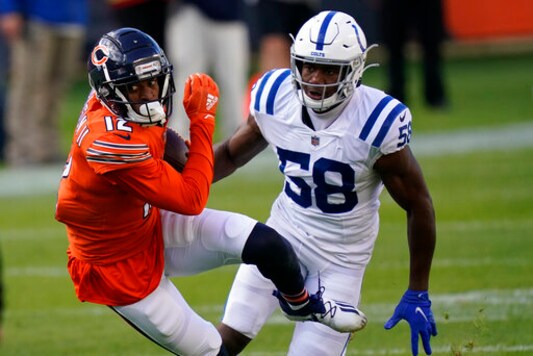 Chicago Bears' Allen Robinson (12) is chased by Indianapolis Colts' Bobby Okereke (58) during the first half of an NFL football game, Sunday, Oct. 4, 2020, in Chicago. (AP Photo/Charles Rex Arbogast)
