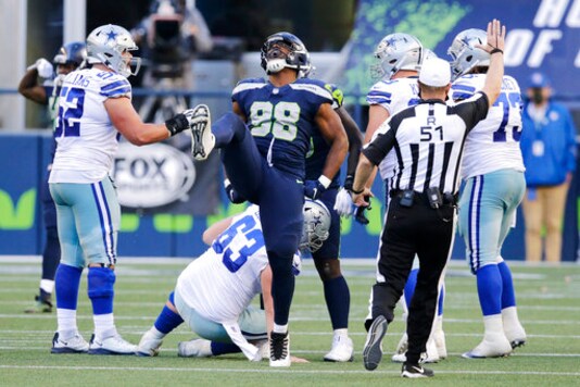 Seattle Seahawks defensive end Alton Robinson (98) celebrates a play during the second half of an NFL football game against the Dallas Cowboys, Sunday, Sept. 27, 2020, in Seattle. The Seahawks won 38-31. (AP Photo/John Froschauer)