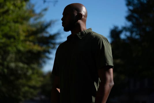 Theo Brown, a former Drug Enforcement Agency trainee, poses for a portrait outside his home in Marietta, Ga., on Wednesday, Oct. 14, 2020. As the DEA continues a decades-long struggle to diversify its ranks, it has received a string of recent complaints describing a culture of racial discrimination at its training academy in which minorities are singled out, derided with insults and consistently held to a higher standard than their white counterparts, according to interviews with former recruits and law enforcement officials and records obtained by The Associated Press. (AP Photo/Elijah Nouvelage) Theo Brown, a former Drug Enforcement Agency trainee, poses for a portrait outside his home in Marietta, Ga., on Wednesday, Oct. 14, 2020. As the DEA continues a decades-long struggle to diversify its ranks, it has received a string of recent complaints describing a culture of racial discrimination at its training academy in which minorities are singled out, derided with insults and consistently held to a higher standard than their white counterparts, according to interviews with former recruits and law enforcement officials and records obtained by The Associated Press. (AP Photo/Elijah Nouvelage)